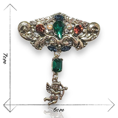 Broche arabesque et cupidon